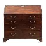 A George III mahogany bureau:,