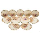 A Royal Worcester fruit painted porcelain dessert service: each piece of shaped and reticulated