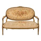 A carved giltwood canape in the Louis XVI transitional taste:, with rosebud,