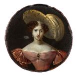 A 19th century papier mache snuff box: the circular lid decorated with a portrait of a young lady