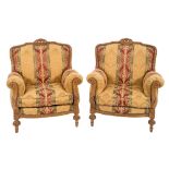A Continental carved beech three piece suite:, comprising a three seat settee and pair of armchairs,