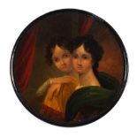A 19th century papier mache snuff box: the circular lid decorated with a portrait of two young