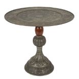 A Moorish pewter circular centre table on a stand:,