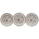 A set of three Chinese famille rose plates: each enamelled with a garden terrace scene with birds,