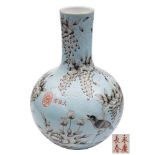 A Chinese pale turquoise-ground bottle vase: painted en-grisaille with a magpie amongst wisteria