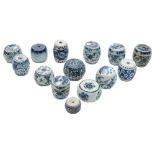 A collection of fourteen Chinese blue and white porcelain scroll weights: of barrel form,