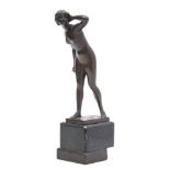 After Meisel A bronze study of a naked female: with left hand raised to her hair,