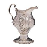 A George III silver pedestal cream jug, maker's mark worn, London, 1768: monogrammed,