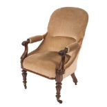 A Victorian carved rosewood open armchair:, with an arched upholstered stuff over back,