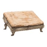 A 19th Century carved wood and grey and gilt decorated angled footstool:, with an upholstered top,