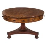 A William IV mahogany circular drum top library table:, fitted with four frieze,