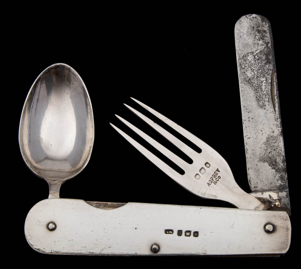 Asprey & Co, a silver plated travelling knife and fork set: stamped Asprey, 10cm. folded.