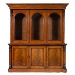 A Victorian mahogany library bookcase:, the upper part with a moulded cornice,
