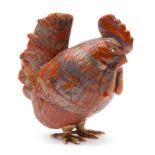 A Continental carved hardstone model of a cockerel: with rose cut diamond inset eyes,