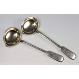 A pair of Imperial Russian silver fiddle pattern sauce ladles: initialled SR below a crown,