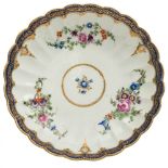 A First Period Worcester 'Royal Marriage' pattern fluted dessert dish: painted with floral bouquets,