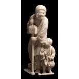 A Japanese carved ivory okimono: of a peasant farmer and his son, holding a hoe in one hand,