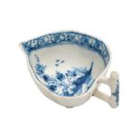 A Lowestoft blue and white butterboat: of leaf shape with stalk handle,