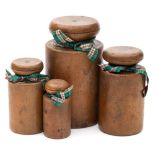 A graduated set of four 19th century turned sycamore pie dollies: of cylindrical form with mushroom