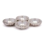 A set of four Continental silver salts: of circular reeded outline, 7cm. diameter, 231gms, 7.43ozs.