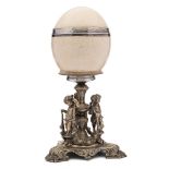 A 19th century ostrich egg table centre piece: the egg with silver girdle,