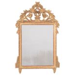 A carved giltwood mirror:, with pierced and shaped flowerhead, foliate scroll,