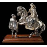 Elkington & Co a silver plated and gilt decorated figure group: depicting a mounted Elizabeth l