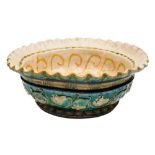 A large Della Robbia Pottery bowl by Lizzie Wilkins: with flared wavy rim,