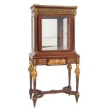 A fine Louis XVI style mahogany and gilt metal mounted vitrine in the manner of Paul Sormani:,