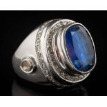 A kyanite and diamond dress ring: with central oval, blue kyanite approximately 16.