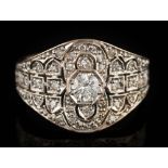 An 20th century 18ct gold and diamond Art Deco-style cluster ring: mille-grain-set with round,