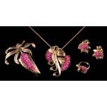 A suite of ruby mounted jewellery: of floral and ribbon designs with clusters of ruby beads,