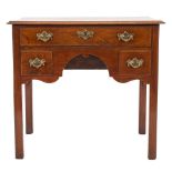 A George III mahogany rectangular side table:, the top with a moulded edge,
