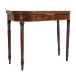 An early 19th Century mahogany and inlaid tea table of D-shaped outline:,