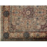 A Meshed carpet:, of large size, the beige,