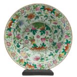 A Chinese export famille rose basin: with flattened everted rim, painted with bats, peony sprays,