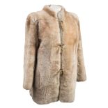 A lady's overcoat by Yves Saint Laurant:, with black fur collar and cuffs,