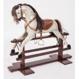 A 20th century rocking horse:, the painted dapple body with hair mane and tail,