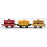 Hornby O gauge, a group of six petrol tank wagons:, ' Motor BP Spirit', 'Pratts', 'Redline',