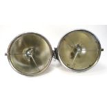 A pair of Lucas P100L headlamps:, triple bar pattern with stippled lens,