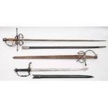 A reproduction swept-hilt rapier and two other reproduction swords.
