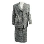 A lady's wool two piece suit by Hardy Aimes, Saville Row, London:, in a stylised tweed pattern,