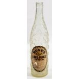 An early 20th century oversized advertising shop display bottle for Roses Lime Juice Cordial:,