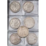 A collection of seven American dollar coins: 1884, 1885, 1889, 1890, 1922, 1921, 1922. (7).