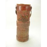 A George V red canvas shot/cordite bucket:, of traditional form with polychrome transfer armorial,