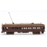 A Japanese brass OO/HO gauge brown painted powered tram car:, maker unknown.