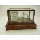 A lacquered brass and mahogany barograph by Casell, London:,