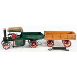 A Mamod SW1 live steam wagon in 'Eddie Stobart 'livery:, green cab and chassis, red spoked wheels,