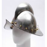 A reproduction Spanish morion helmet:, 20th century with broad comb, brass studs and a wide rim,