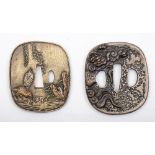 Two reproduction Japanese tsubas:, both in the traditional style, one with Herons and foliage,
